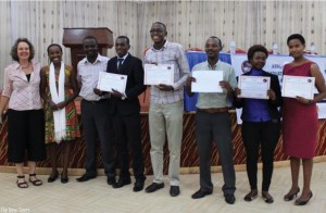 Umugiraneza (fourth left) poses for a picture with other contestants and Survivors Fund officials after the awards function on Monday. Umugiraneza bagged this year's Innovation Entrepreneurship Award worth Rwf5m in funding. (Solomon Asaba)