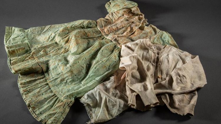 Clothing of sisters Clarisse and Raissa recovered from a grave in Rwanda and donated by their mother Immaculee Mukantaganira